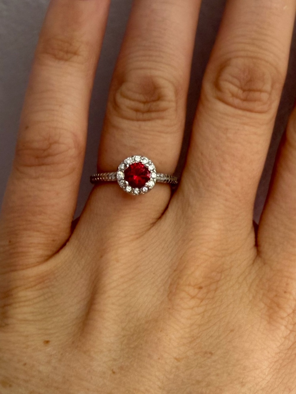 Sterling Silver Halo Ring with Red Center Stone